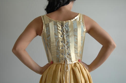 The corset is in the medieval style.