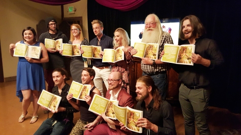 Here are all the models holding the book open to one single page for our friend who couldn't make it!